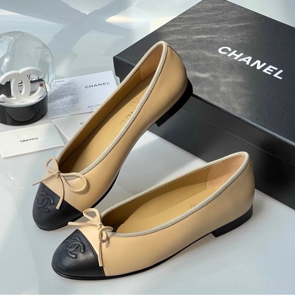 CHANEL. Shoes - CHANEL Two-Tone Beige and Black Cap-Toe Ballet Flats
